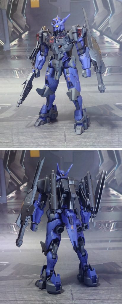 ガンダム・ルブリス・アノクタの前後ろ。工作は、ゲート痕処理、パーティングライン・段ズレ・ヒケの対処、面出し、肉抜き穴埋め、合わせ目消し、穴開け、市販ディティールアップパーツの貼り付け・埋め込み、可動軸への真鍮線打ち込みを実施。仕上げに、梵字デカールを採用。機体名“アノクタ”の由来である“阿耨多羅三藐三菩提(あのくたらさんみゃくさんぼだい：無上の真実なる完全な悟り)”に因み、それを体現する仏“大日如来”を表す梵字“バン”をあしらってみました。