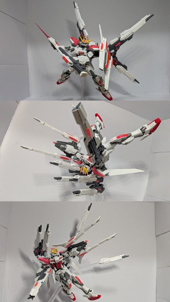 専用シールド　アルケミア　（ラテン語で錬金術）延伸式のビームキャノンを両サイドに備え、中央からはビームブレイド発振も可能な複合シールド。ビームキャノン基部、シールド表面にENC装甲を搭載。シールドで受けたビームを即座にビームキャノンの出力として利用出来るようになっている。コンパス採用機のシールドブーメランのように、簡易ドラグーンで自律飛行しての遠隔攻撃が可能前腕に装備しており、他に肩部ハードポイントやグリップでの装備も可能&nbsp;