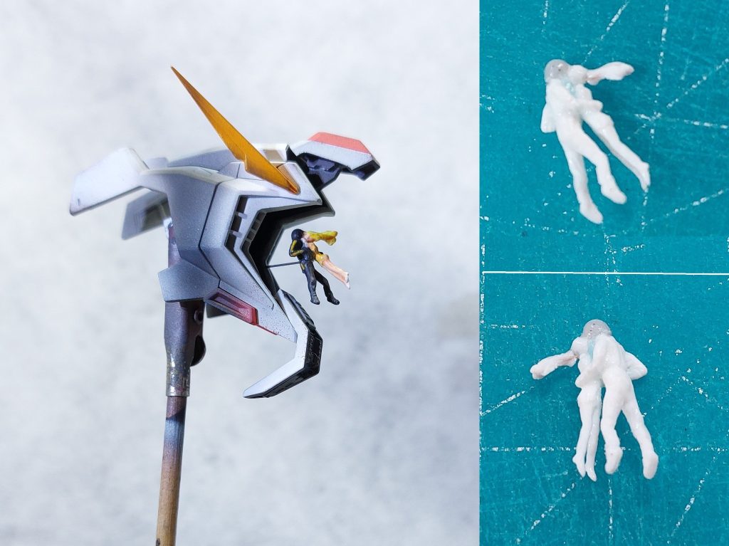 ■1/144ハサウェイ＆ギギ　1/144ハサウェイとギギのフィギュアは、ビルダーズパーツを芯に用いて製作しました。最初に大まかにフォルムを整えながら２体を別々に製作し、その後、上半身を向き合わせて接着し、両者の腕を造形しました。手元に資料が無かったため、アマプラで映画の静止画像を見ながら少しずつリューターで削り、理想のフォルムをめざしました。削りすぎた場合は、瞬間接着パテを盛り付けて再度リューターやヤスリで整えます。流し込みタイプのタミヤセメントのハケで表面を数回撫でることにより、脚部等のなめらかな曲線を再現できました。　全高約12.0mmの小スケールなので限界はありますが、造形にあたっては人間の骨格や筋肉を意識することに最も注力しました。２体とも長くて細い脚でプロポーションが良く、ハサウェイは体にフィットしたノーマルスーツ、ギギは生足でそれがさらに強調されています。リューター使用時には誤って脚を切り飛ばさないように慎重に作業を進めました。　デジタル造形への興味関心がつのるばかりですが、未だにプラ材や瞬間接着パテの盛り削りや手びねりでミニフィギュアの製作を楽しんでいます。
