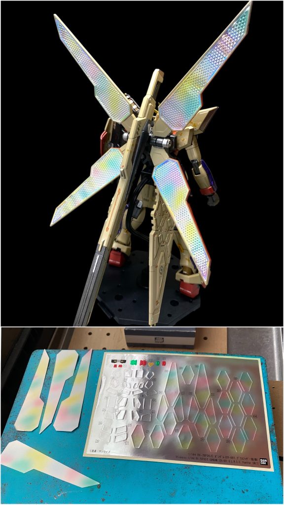 リフレクターの中に貼るホログラムシートは、そのままでも偏光してキラキラと綺麗なんですが、先日発表されたロボット魂のDXの製品画像を見て、塗装でもあれに近い表現が出来ないか？と、シートの上から蛍光クリア系でグラデーション塗装をしてみました！予備リフレクターとして取り付けたグラスフェザーのホイルシールも同様に塗装した上から、さらに百均のオーロラシートを貼り付けています。今までは水性アクリル系で蛍光ブルーの塗料というのを持っていなかったんですが、春に京都のボークス本店さんでファレホのゲーミングブルーを仕入れていたのを今回初使用してみました！&nbsp;